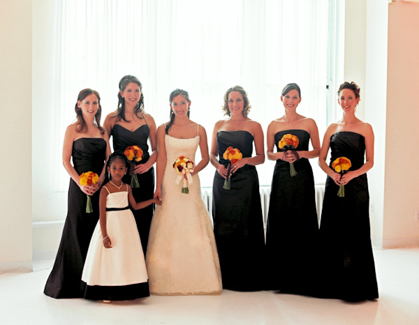 photo by New York City based wedding photographer Karen Hill - group portrait - bride in ivory a-line style gown with bridesmaids in black full length dresses - flower girl in white dress with black sash